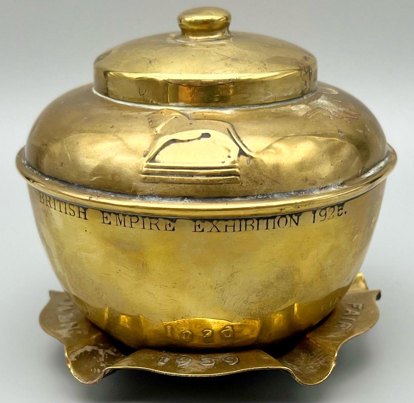 A 1939 Brass New York Fairs Ashtray and a 1925 British Empire Exhibition Sealed Pot. Ashtray -