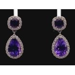 A Spectacular Pair of Amethyst and Diamond Earrings. A square cut and large teardrop amethyst