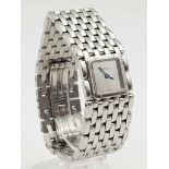 A ELEGANT CARTIER STAINLESS STEEL LADIES WRIST WATCH WITH SQUARE FACE AND MIRRORED DIAL AND
