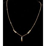 A 9K Yellow Gold Necklace with Seed Pearl Decoration. 40cm. 2.15g total weight.