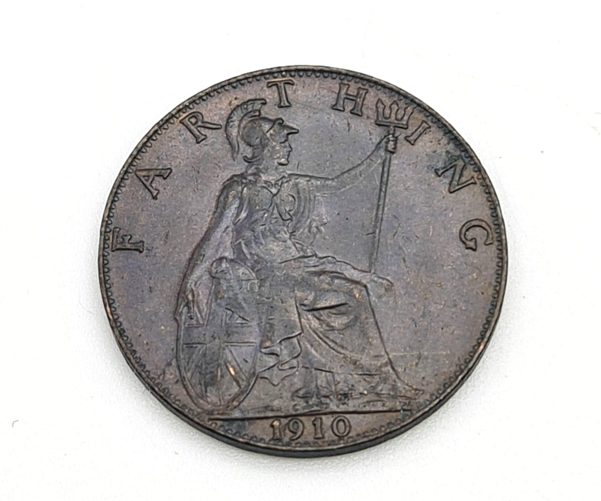 A 1910 Bronze Farthing Coin. Good extremely fine. Obverse - Features the uncrowned portrait of