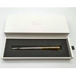 Christian Dior Silver Gold plated ballpoint pen in original box in new condition. Comes with