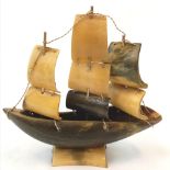 Vintage sail boat, possibly made with cow horn, has been updated using metal wiring, good