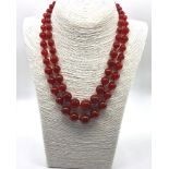 A Fire Autumn Agate Graduated Two-Row Bead Necklace. 14mm largest bead. 42-46cm.