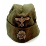 Waffen SS Enlisted Mans/Nco’s Overseas M40 Cap. The insignia passes the black light test and has