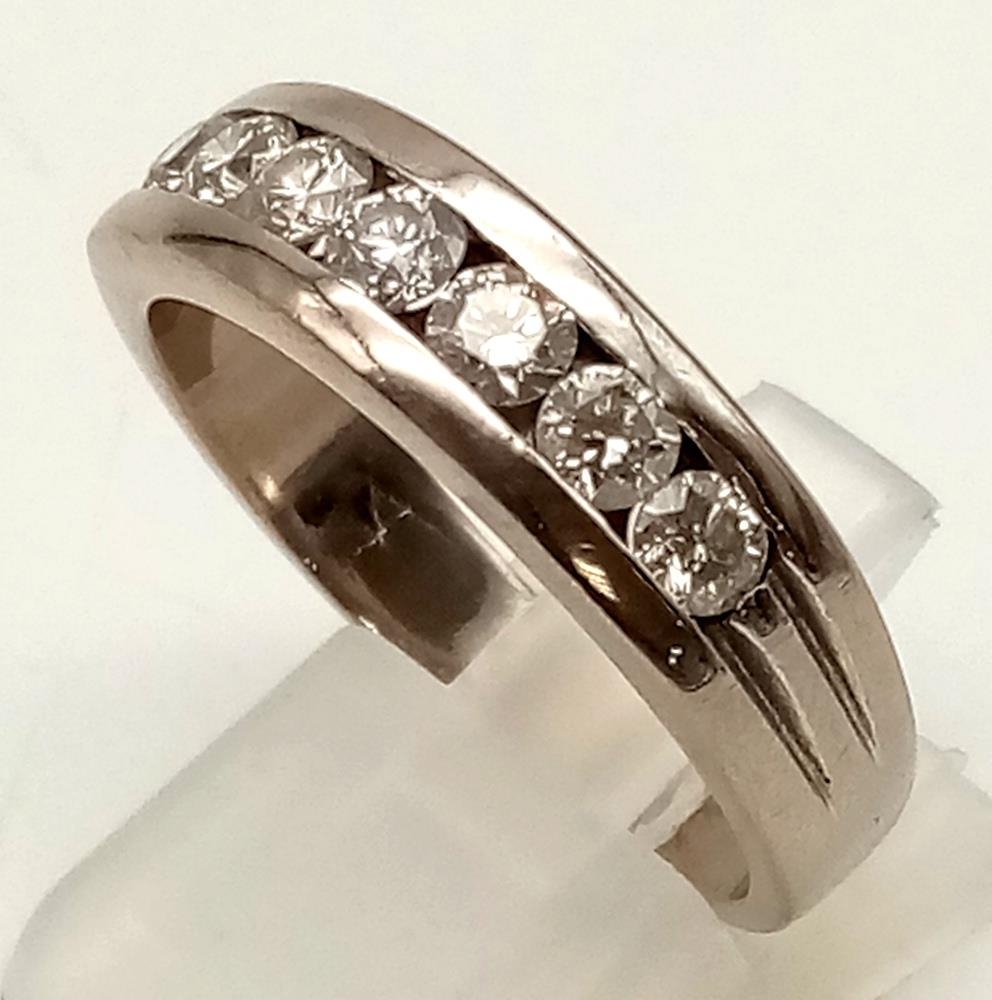 An 18K White Gold (tested) Seven Diamond Channel Gents Dress Ring. 1.5ct bright diamonds. Size U 1/ - Image 2 of 4