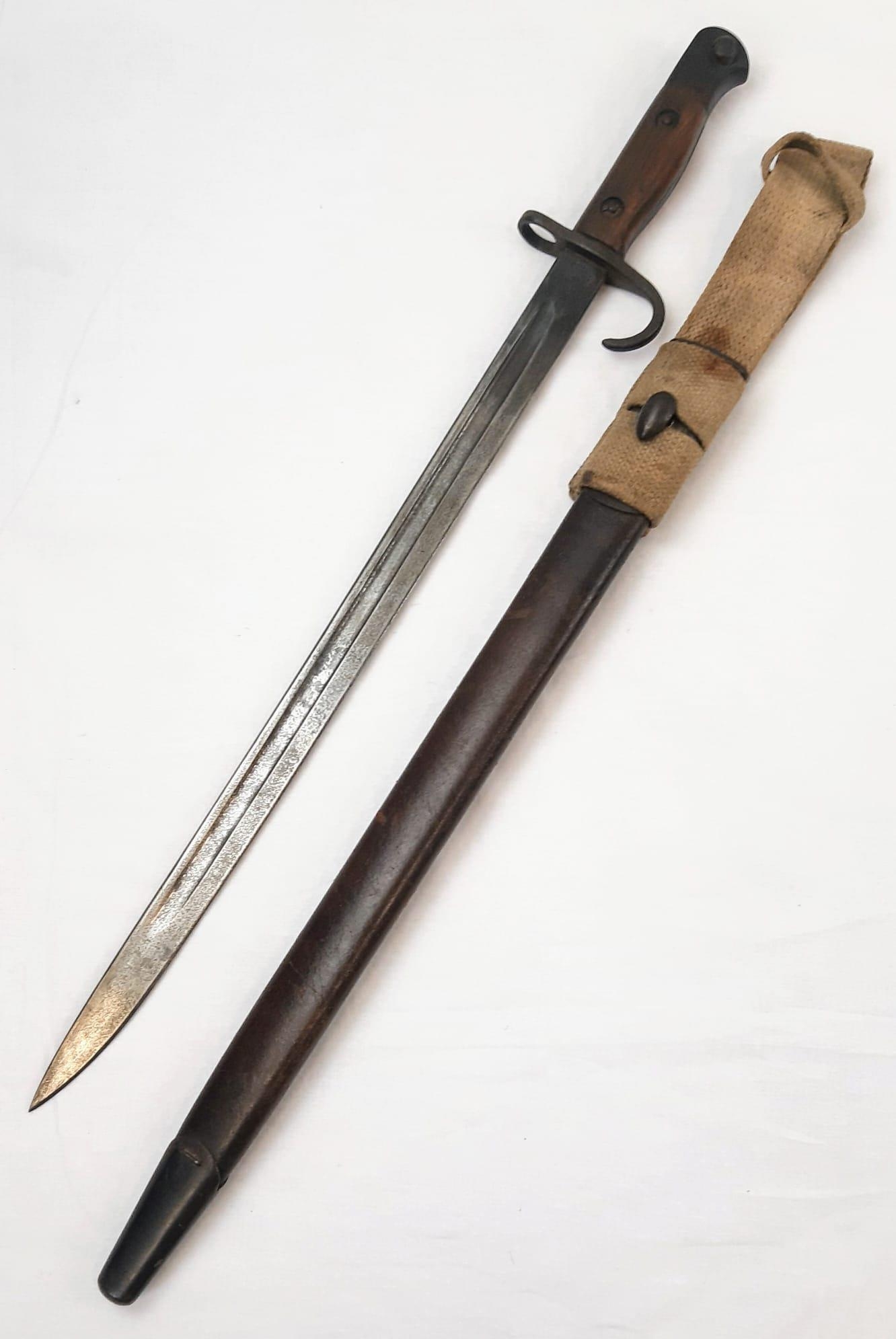 1907 Hooked Quillion Bayonet. Maker Enfield. Complete with early tear drop scabbard and frog.