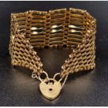 A Vintage 9K Yellow Gold Ladder-Link Bracelet with Heart Clasp. 20.26g total weight.
