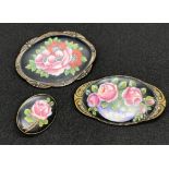 Victoria enamel set of three tested solid silver brooches. Sizes are: 3cm x 2.8cm, 5.7cm x 3.1cm,