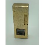 Vintage 1970’s SUNNEX lighter with clock, in textured barked gold effect. Clock is active and