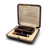 Antique 9ct tortoise shell cigarette case with cigarette pipe in miniature style in original box.