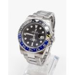 A gents ROLEX GMT MASTER II. 42 mm dial with black face and blue bezel. In excellent/unused