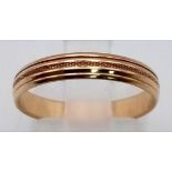 A Vintage 14K Yellow Gold Band Ring. Linear design on exterior. Size N. 2.08g total weight.