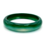 A Green Jade Bangle. 6cm inner diameter.