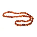 AMBERESQUE STRAND OF BEADS. 65cm