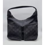A GUCCI bag with two external pockets, with original protective cloth bag. Appr. dimensions: 30 x 13