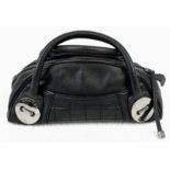 A Chanel Caviar Leather Black Mini Handbag. Twin exterior pockets - silver toned hardware.