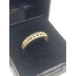 9 carat GOLD RING having hearts and crosses in openwork design. 1.87 grams. Size L 1/2.