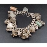 A Wonderful Eclectic Silver Charm Bracelet. Some wonderful rare charms including a 10 shilling and 1