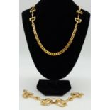 A chunky gold tone necklace and bracelet set in the horses bit design. Bracelet length 19cm,