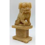 An Early Chinese Soapstone Dog Foo Figure. 21 x 11cm.