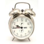 A Backwards Double Bell Alarm Clock. In working order. 16cm tall.