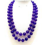 A Purple Jade Two-Strand Bead Necklace with Gilded Spacers and Clasp. 42cm. 12mm beads.