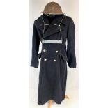 An Original WW2 Civil Defence Air Raid Warden Coat and Helmet. You can just about make out on the