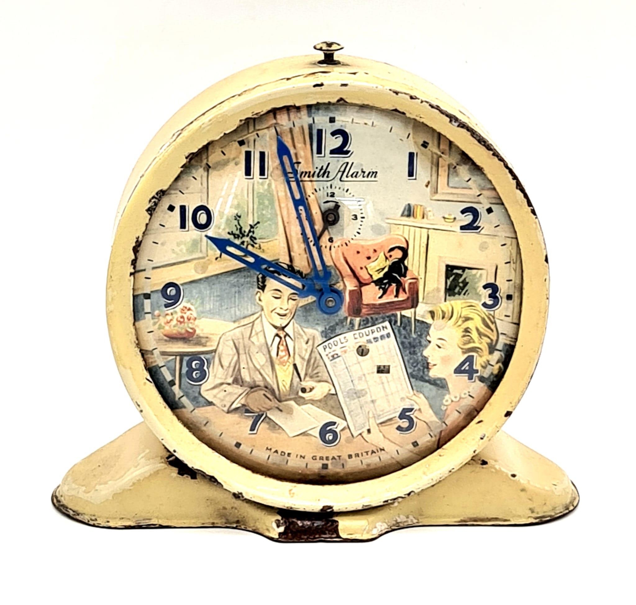 A Classic Smiths Vintage Pools Alarm Clock. Pen and pools coupon move! Works but a/f. 12cm tall.