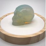 A Fire Opalite Hand-Carved Quartz Crystal Skull. 5 x 4cm.