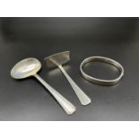 Three Vintage Sterling Silver Items. A Food Pusher! A bangle with opening clasp and an egg spoon.