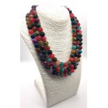 A Dragon-Veined Multi-Colour Three-Row Agate Bead Necklace. Over 1300ct weight. 10mm beads. 42-46mm.
