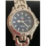 Ladies quartz wristwatch having dark blue face with rotating numbered bezel, sweeping second hand