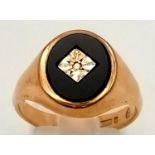 A 9K Yellow Gold Diamond and Black Onyx Signet Ring. Size P 1/2. 4.04g.