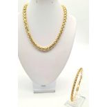 A chunky choker necklace and matching bracelet set, gold tone metal, bracelet length 21cm, choker