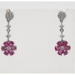 A Spectacular Pair of Ruby and Diamond Drop Earrings. A total of 1ct of diamonds leading to two