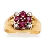 An 18K Ruby and Diamond Ring. Four rubies and diamonds in a floral design. Size K. 3.47g.