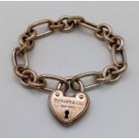 A Tiffany and Co 925 Silver Heart Clasp Bracelet. 16cm. 35.64g total weight. Comes in a Tiffany box.