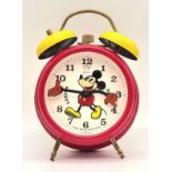 A Vintage German Made Mickey Mouse Double Bell Alarm Clock. 18cm tall. Works but a/f.