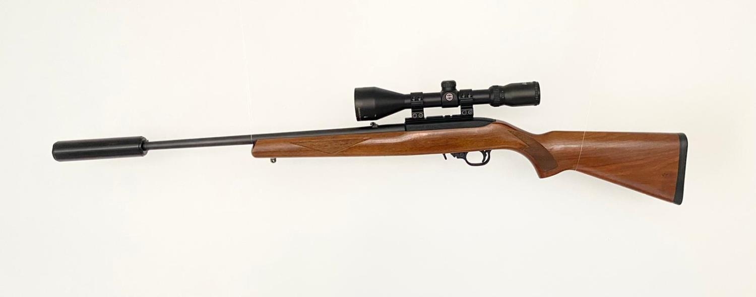 A Ruger Model 10/22 Semi Automatic Rifle. Good wood stock. Fitted Hawk Sport HD 3-9X50 scope and