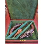 A cased pair of flintlock Greatcoat Pistols by Leech of Colchester/renown gunmaker since 1790.