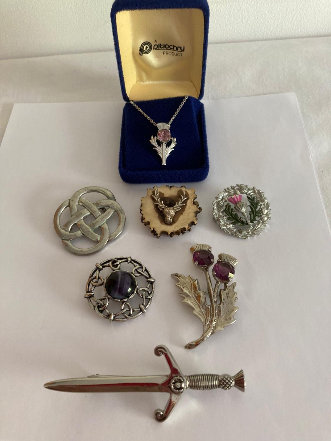 Selection of Scottish/Celtic themed brooches and pendant with chain. Vintage and later.
