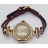 A 14K Gold-Cased Ladies Watch. Mechanical movement. Case -20mm. In working order but because of