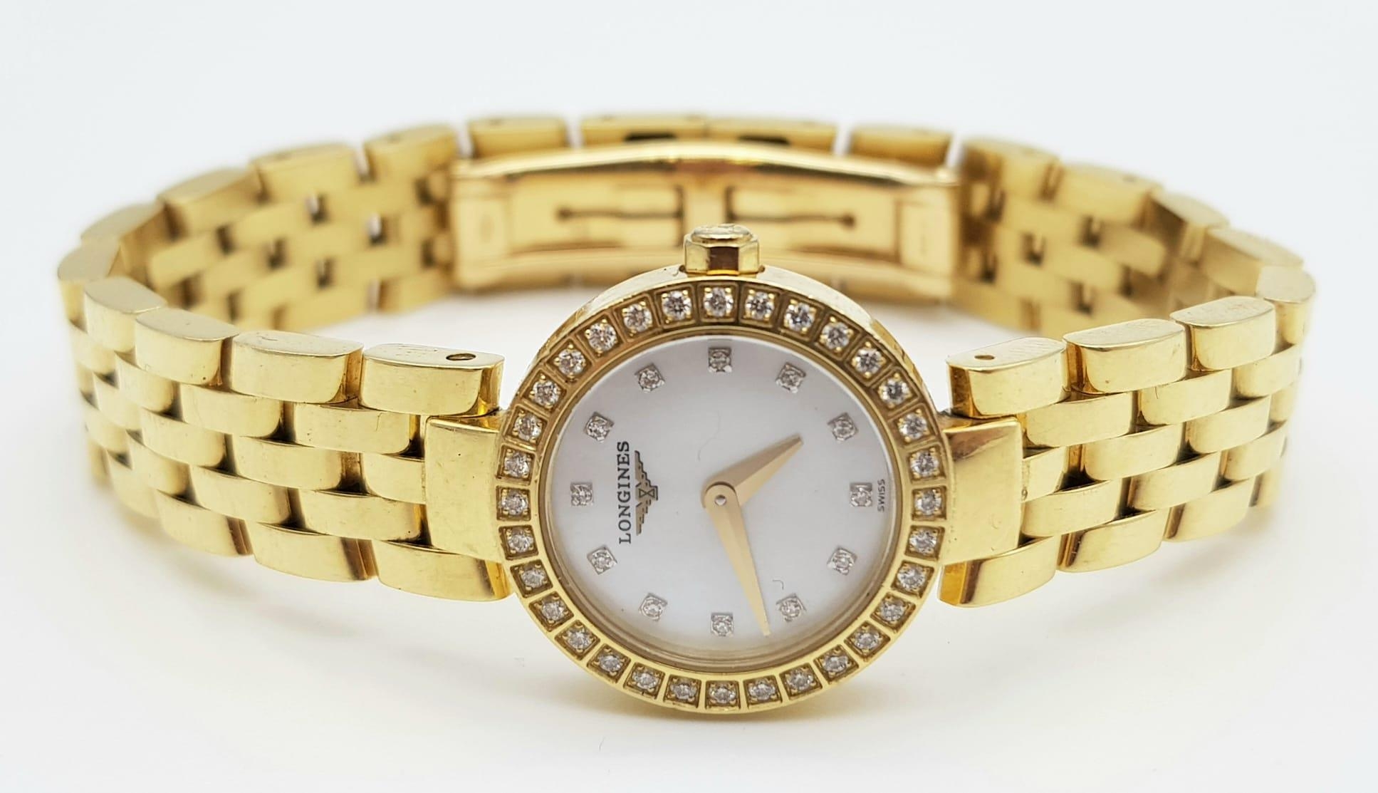 Longine ladies watch 18k diamond watch in original box and certificate. 54.3 grams. 19mm.