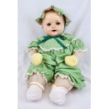 An Original Vintage Possibly Antique German Baby Doll. It has flighty eyes that seem to follow you