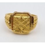 A 22K Yellow Gold Signet Ring. Pierced and engraved decoration. Size V. 9.1g. Ref - 9212. Ring