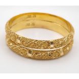 Two 21K Yellow Gold Asian Wedding Filigree Bangles. 7cm inner diameter. 39.42g total weight. Ref -