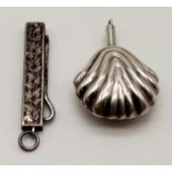 Two tested sterling silver pieces consisting of: Miniature perfume bottle pendant. 7.03 grams. 4cm