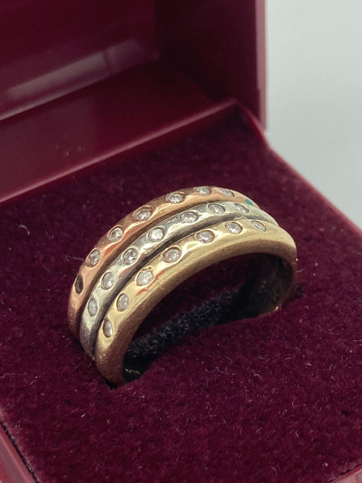 9 carat GOLD and DIAMOND RING ,having three bands of different coloured gold set with diamonds and