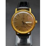 A 1960s Omega Seamaster Gents Watch. Black leather strap and gold plated case - 35mm. Gold tone dial